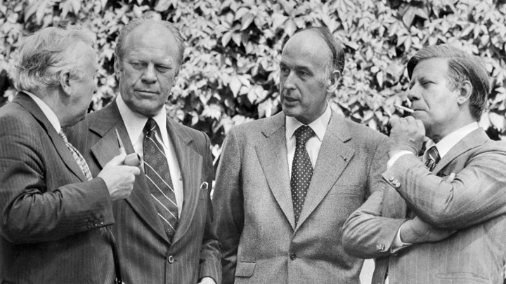 Gerald Ford, Harold Wilson, Valery Giscard d'Estaing, and Helmut Schmidt speaking with each other