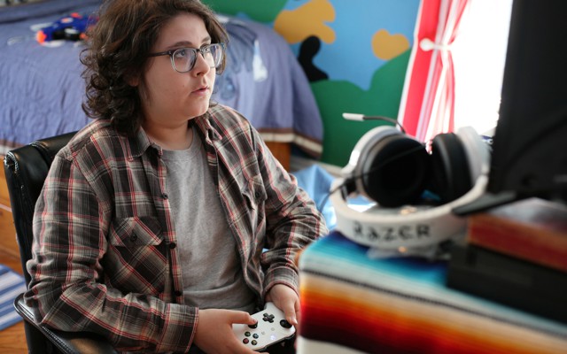 A boy holding a video-game controller
