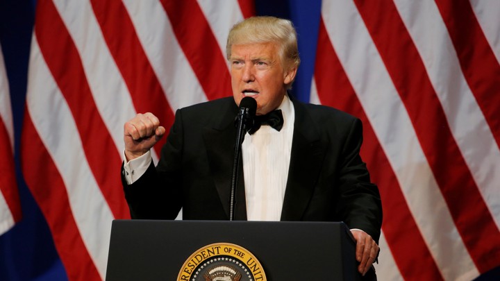 President Tump speaking at a podium