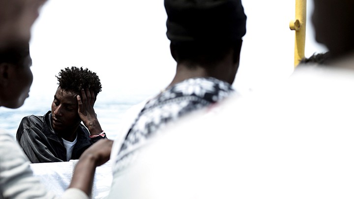Migrants are pictured on the deck of the MV Aquarius in the central Mediterranean Sea on June 12, 2018.