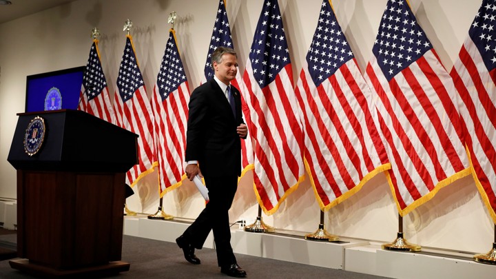 FBI Director Christopher Wray leaves a news conference on the new Inspector General report on Thursday.
