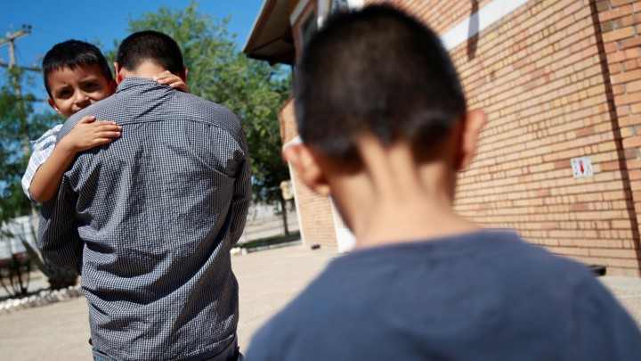 Epigmenio Centeno, a Salvadoran migrant, with his children