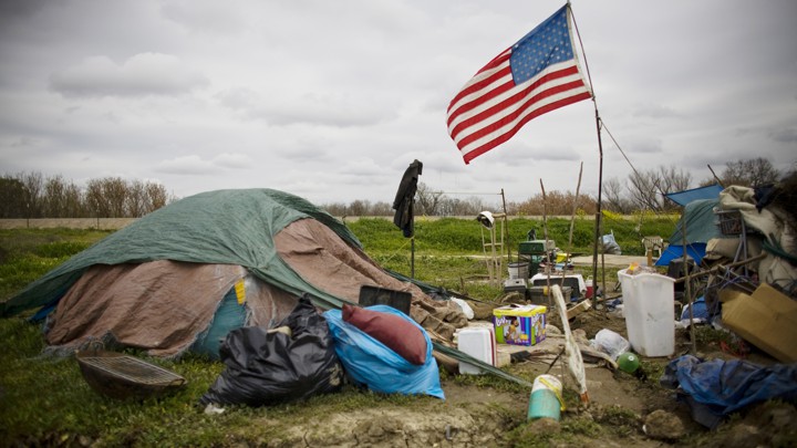 A tent city with an American flag raised