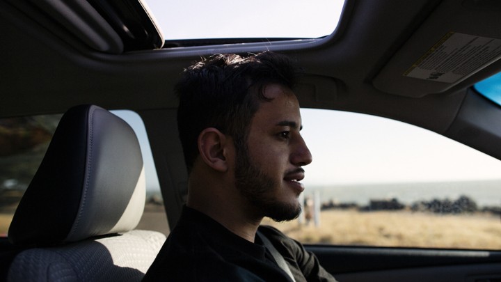 A man in his car in West Oakland
