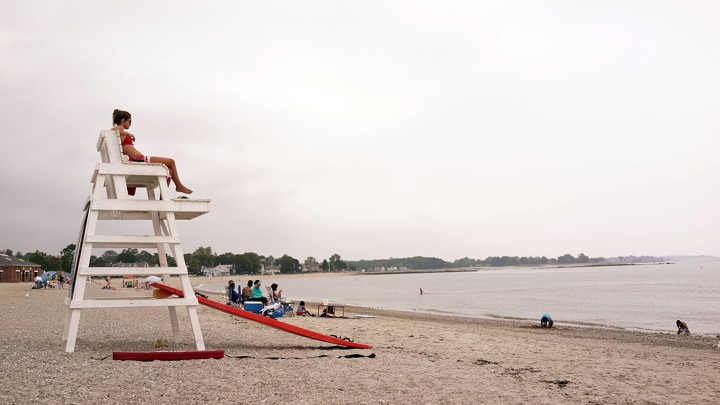 A female lifeguard overlooks the ocean