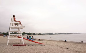 A female lifeguard overlooks the ocean