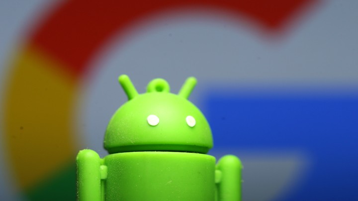 A small figurine of Android's green-man logo