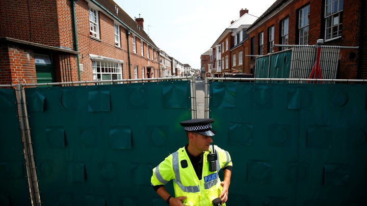 A police officer stands guard in the English town of Amesbury on July 5, 2018.