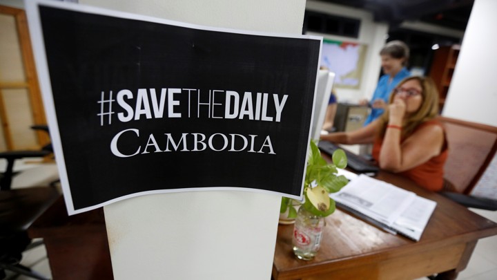A sign says "Save The Daily Cambodia" in the newspaper's newsroom in September 2017