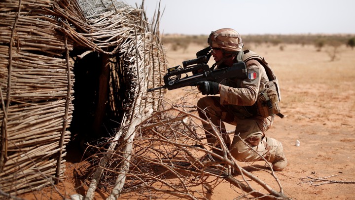 A French soldier controls a Tuareg home near Tin Hama, Mali