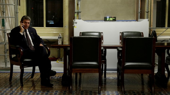 West Virginia Senator Joe Manchin takes a phone call.