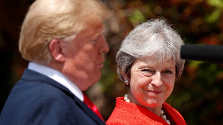British Prime Minister Theresa May reacts as she and President Trump hold a press conference at her country home in Chequers on July 13, 2018.