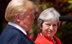 British Prime Minister Theresa May reacts as she and President Trump hold a press conference at her country home in Chequers on July 13, 2018. 