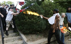 Corey Long sprays a makeshift flamethrower at white nationalist demonstrators