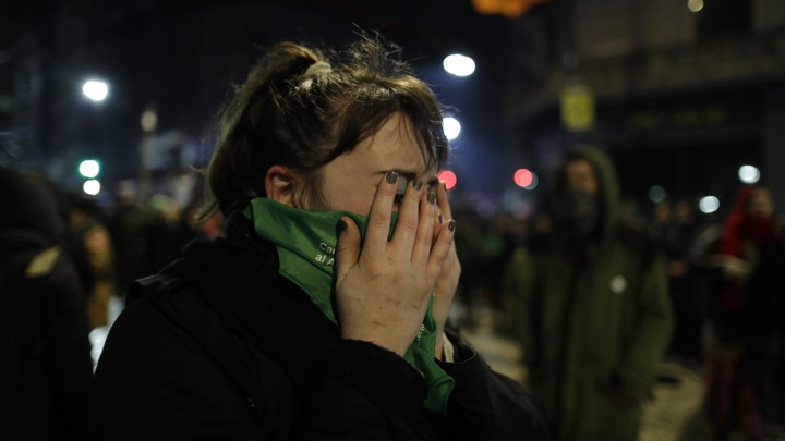 A woman reacts to the decision by Argentina’s lawmakers to vote against a bill that would have loosened the country’s restrictive abortion laws in Buenos Aires on August 9, 2018.