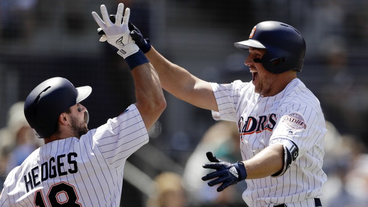 The San Diego Padres' Hunter Renfroe (right) celebrates with his teammate Austin Hedges.