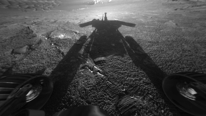 The Opportunity rover photographs its shadow on Mars.