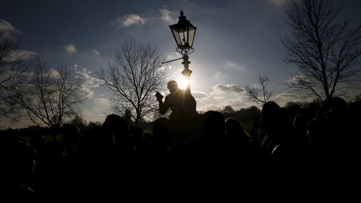 A speaker addresses a crowd