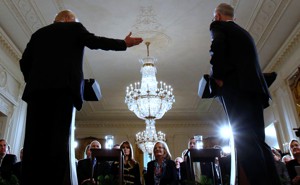 President Donald Trump gestures toward the former Australian prime minister inside the White House