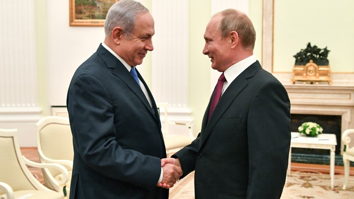 Netanyahu and Putin shake hands at a meeting at the Kremlin in July.