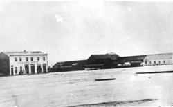 A black-and-white photograph from the 1880s shows the Fresno hotel next to the Fresno train station, the stop on the Southern Pacific Railroad around which the city would develop.