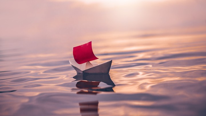 A paper boat on water