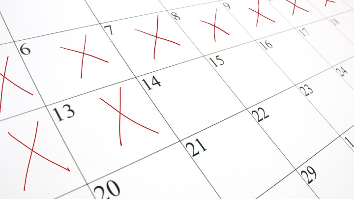 A close-up picture of a calendar with several days crossed off