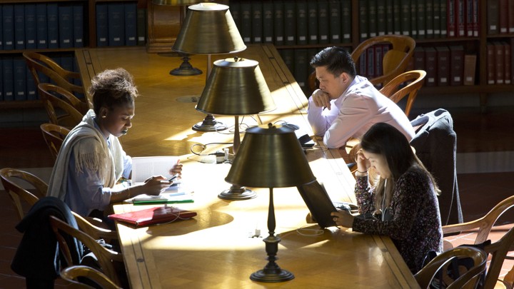 People read in the Rose Main Reading Room of the New York Public Library