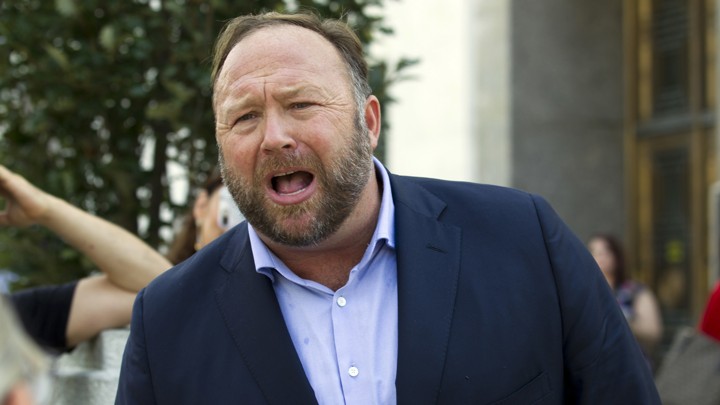 The conspiracy theorist Alex Jones speaks outside of the Dirksen Senate Office Building.