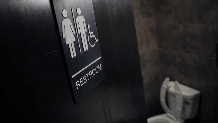 The door to a public bathroom in a coffee shop