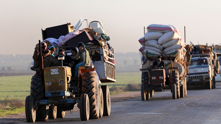 Convoys of displaced Syrians leave Idlib in January.