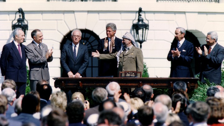 Israeli Prime Minister Yitzhak Rabin, U.S. President Bill Clinton, and PLO Chairman Yasser Arafat after the signing of the Israeli-PLO peace accord on September 13, 1993