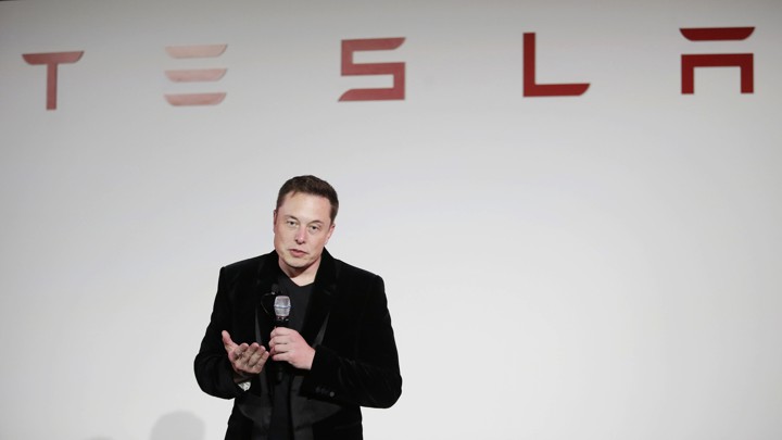 Elon Musk gives a presentation at Tesla