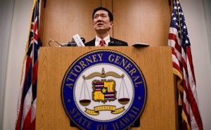Hawaii Attorney General Douglas Chin speaks at a press conference after filing an amended lawsuit against Donald Trump's travel ban on March 9, 2017.