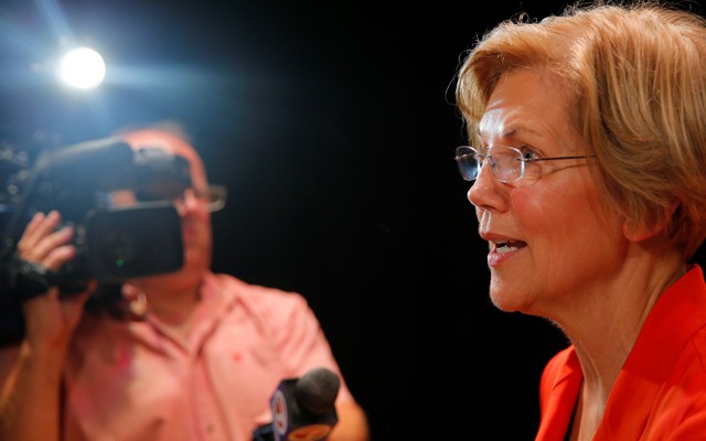 Elizabeth Warren talking into a microphone