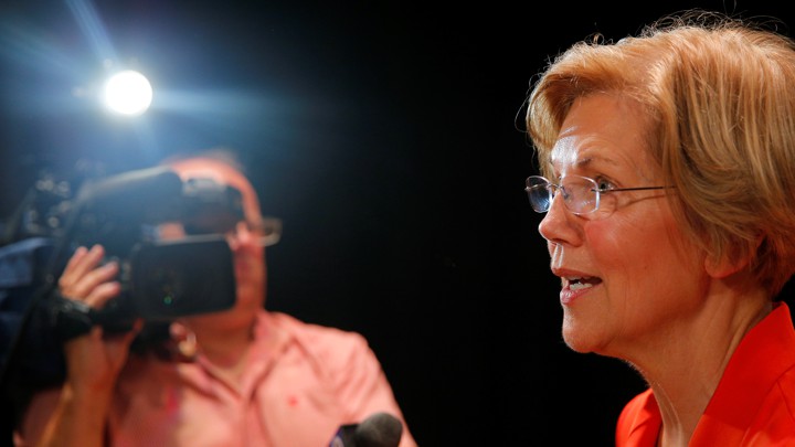Elizabeth Warren talking into a microphone