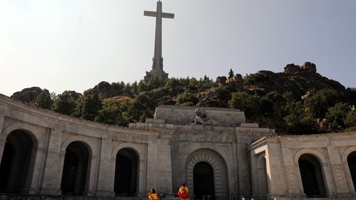 Spain's Valley of the Fallen, where Franco is buried. A large cross sits on a hill atop a monument.