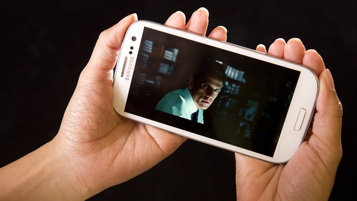 The HULU Plus app displays an image of Ben Stiller as it plays a movie trailer for the film 'The Secret Life of Walter Mitty' on a Samsung Galaxy phone