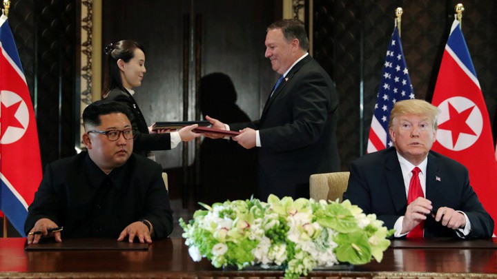Mike Pompeo stands with Kim Jong Un's sister Kim Yo Jong behind Trump and Kim at their meeting in Singapore in June.