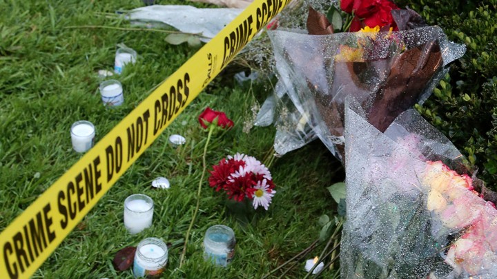 Flowers and candles outside the Tree of Life synagogue