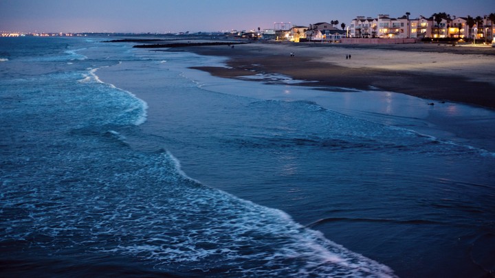 A day before the January 2018 king tide, waves break in front of condos along Imperial Beach's shoreline.