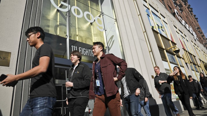 People walking outside of a Google building
