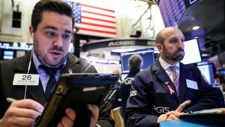 Traders work on the floor of the New York Stock Exchange on November 20, 2018.