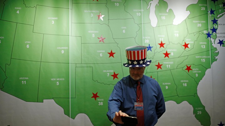 A man takes a selfie in front of the Electoral College map during a U.S. Election Watch event hosted by the U.S. Embassy at a hotel in Seoul, South Korea, November 9, 2016.