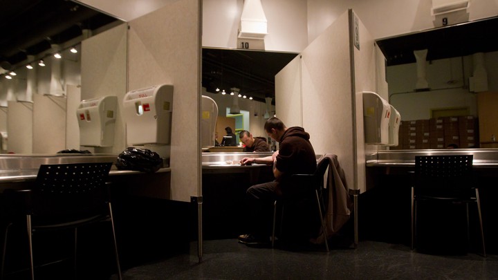 A man injects heroin at a supervised-consumption site in Vancouver.