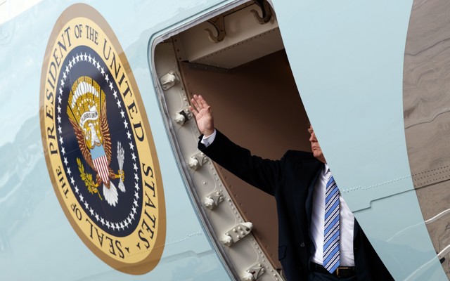 Trump waves as he boards Air Force One in March.