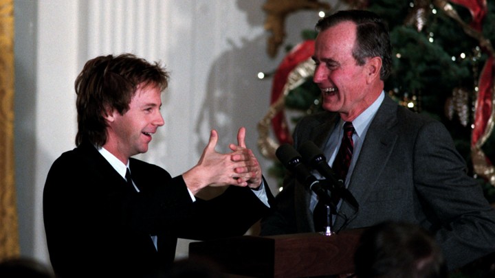 In 1992, the comedian Dana Carvey performs his imitation of President George H. W. Bush in the East Room of the White House.