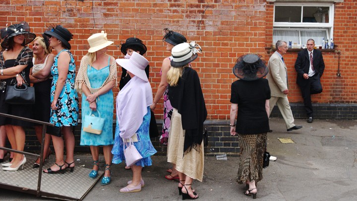 women wait in line for the bathroom