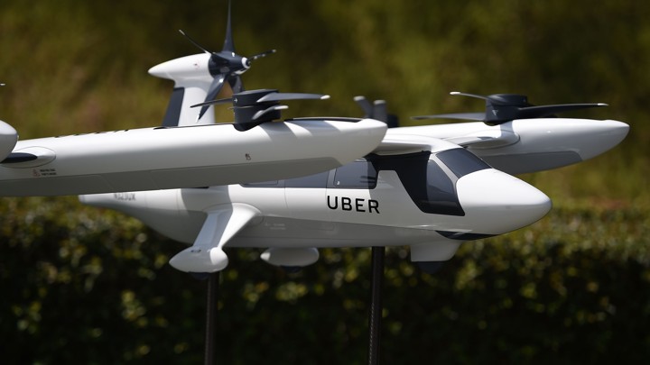 A model of Uber's flying taxi is displayed at the Uber Elevate Summit on May 8, 2018.