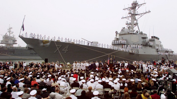 Bill Clinton speaks at a memorial service for the victims of the USS Cole bombing in October 2000.